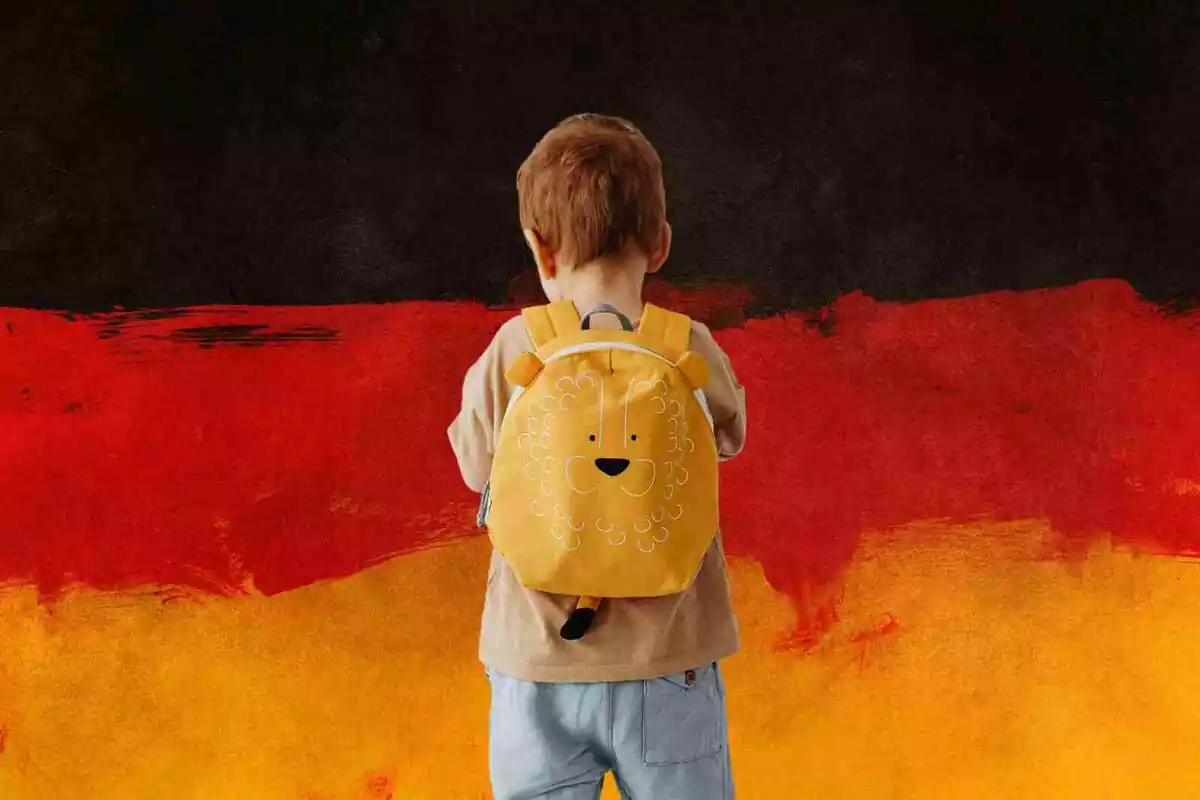 Una bandera de Alemania con un niño de espaldas